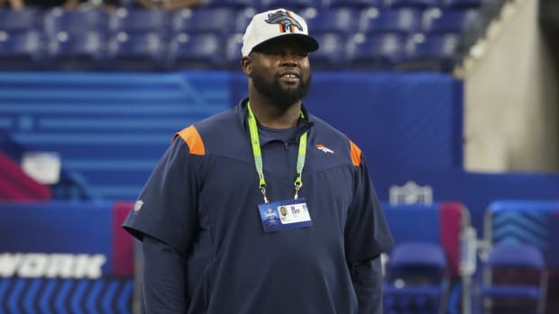 Denver Broncos coach Marcus Dixon watches drills during the 2022 NFL Scouting Combine at Lucas Oil Stadium.